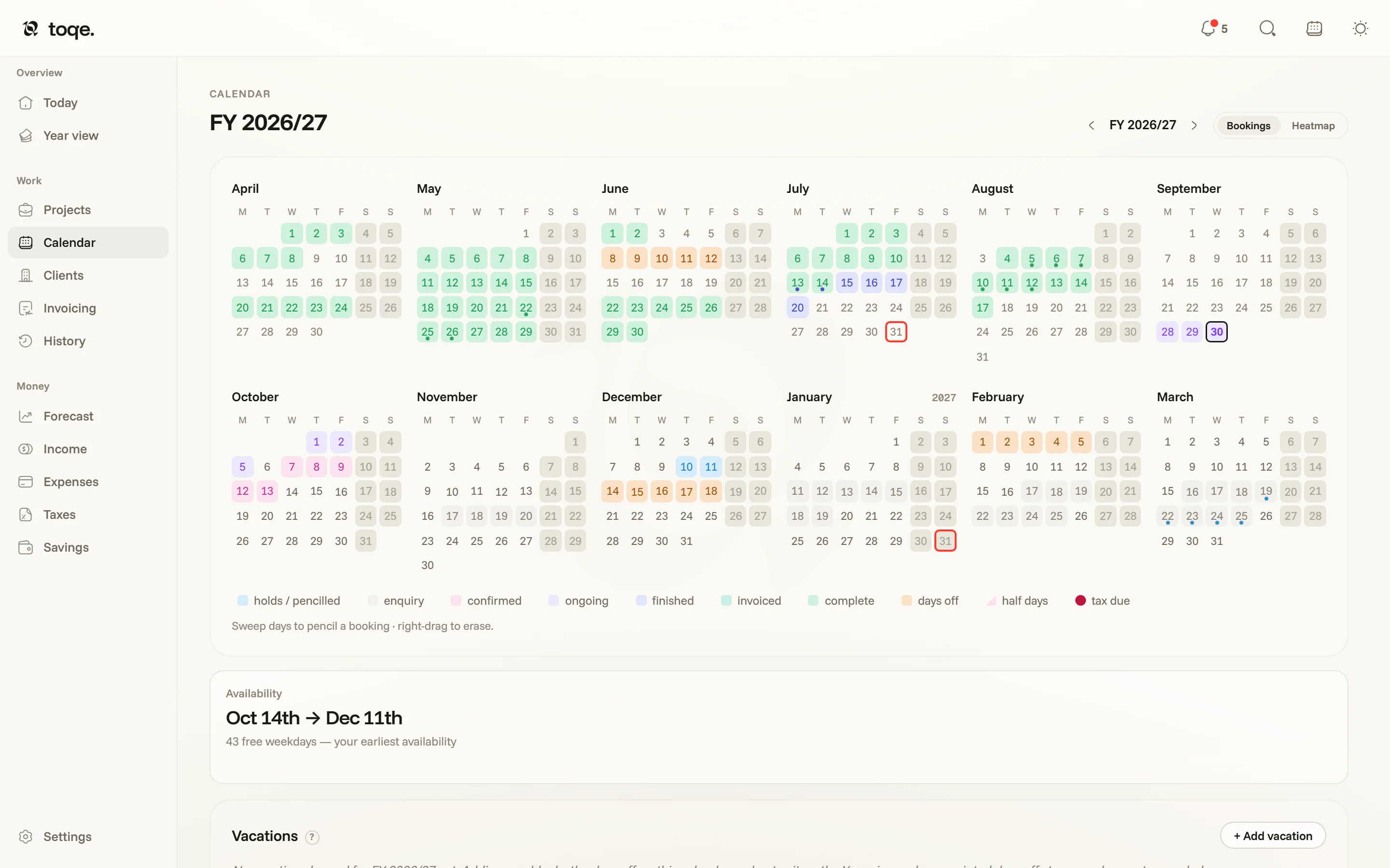 The Bookings calendar — a fiscal year of days wearing their status colours, with the legend beneath